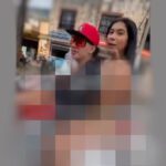 joven en moto con chica en bikini por Manrique, medellín