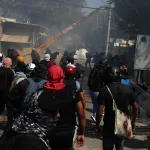 Presuntos policías implicados en muerte de joven de Ayotzinapa se entregan en México